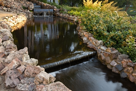 Summer city park with waterfallの写真素材