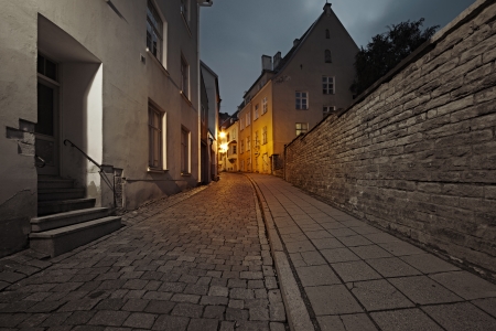 Old European street at nightの写真素材