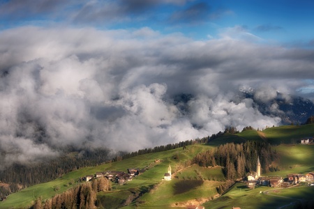Alpine village in Dolomites mountainsの写真素材
