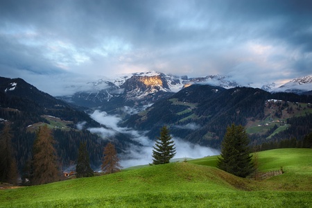 Cloudy sunrise over Dolomite mountainsの写真素材