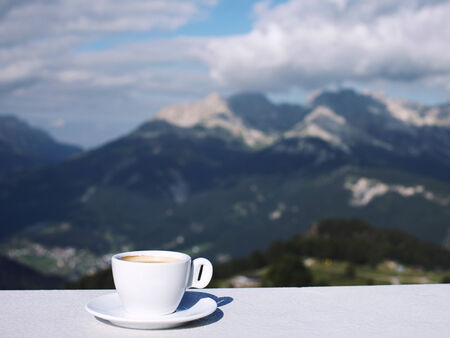Morning coffe cup with mountain viewの写真素材