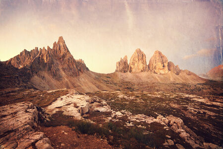 Retro style image of Tre Cime at sunrise, Italian Dolomitesの写真素材