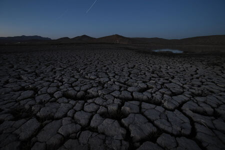 Cracked soil landscape after sunset. Crimea, Ukraineの写真素材