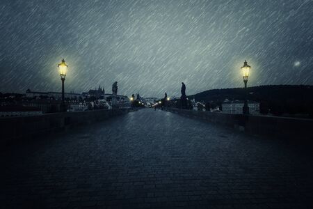 Charles Bridge at rainy night, Prague, Czech Republicの写真素材