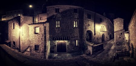 Old Medieval town street at nightの写真素材