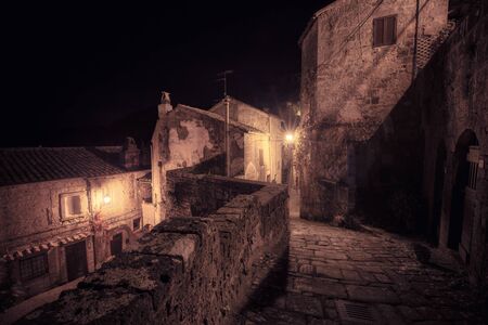 Medieval town street at nightの写真素材