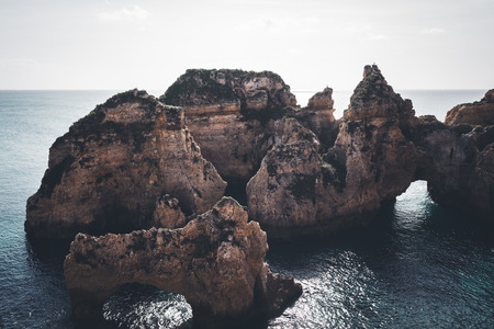 Rocky coastline of Atlantic ocean, Algarve, Portugalの写真素材