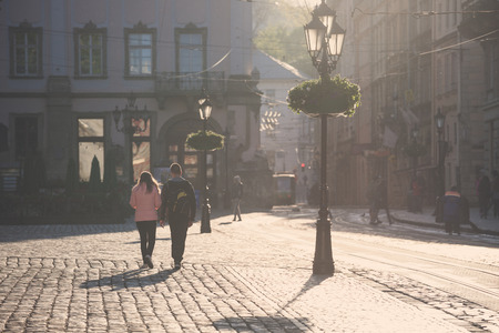 LVIV, UKRAINE - MAY 6, 2016: Morning streets of Lviv city. Old city center square.のeditorial素材