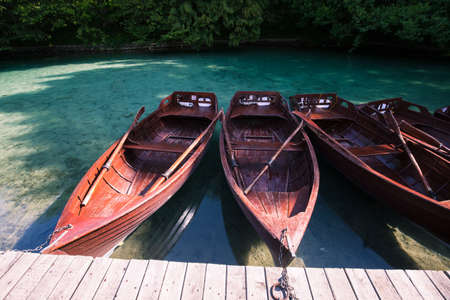 Boats near the pier on the lakeの写真素材