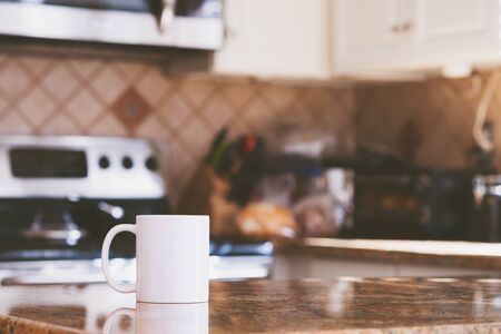 Modern kitchen interior and white coffee mugの写真素材