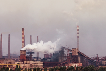 Plant with smoke. Air pollution conceptの写真素材