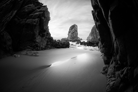 Black and white photo of rocky coastline of Atlantic ocean, Ursa beach, Portugalの写真素材