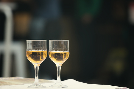 Glass of wine at the street cafe tableの写真素材