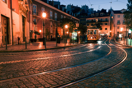 LISBON, PORTUGAL - MAY 6, 2017: Traditional yellow tram at the old night streets of Lisbon, Portugalのeditorial素材