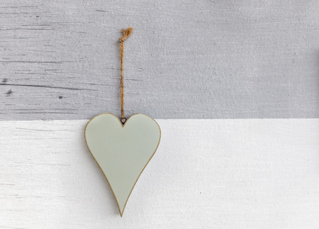 Wooden heart over wall scratched backgroundの写真素材