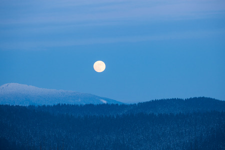 Full moon rising over winter Smoky Mountains. Great Smoky Mountains National Park, USAの写真素材