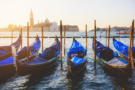 Venice classic sunrise view with gondolas on the waves. Venice, Italyの写真素材