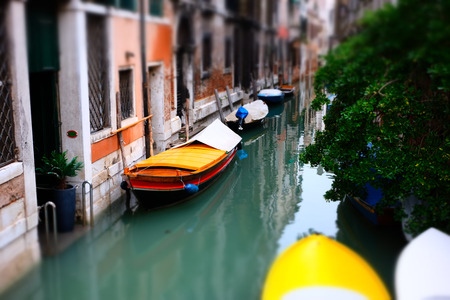 Traditional Venice boat at the canal. Tilt shift view. Venice, Italyの写真素材