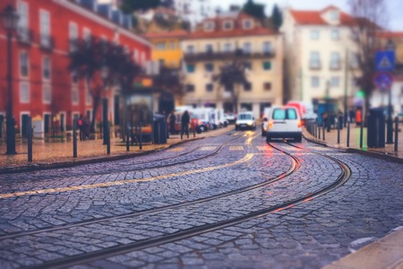 Illuminated street of old european town at night. Tilt-shift effectの写真素材