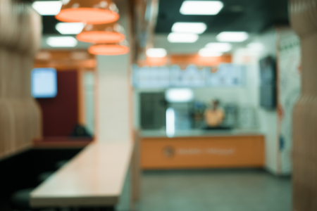 Coffee shop blur background with bokeh. Blurred interior background.の写真素材