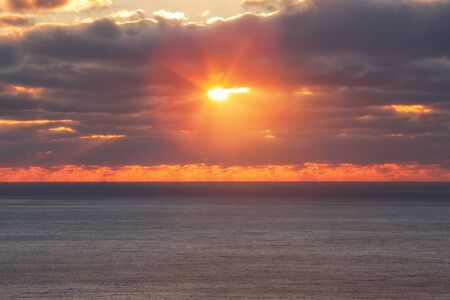 Dranatic cloudy sky sunrise over Atlantic ocean, FL, USAの写真素材
