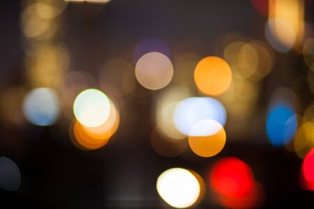 Abstract urban night light bokeh defocused backgroundの写真素材
