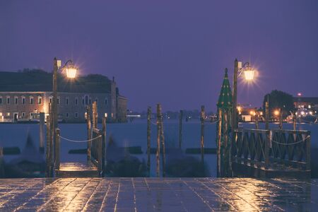 Venice classic lantern on seafront night view, Italyの写真素材