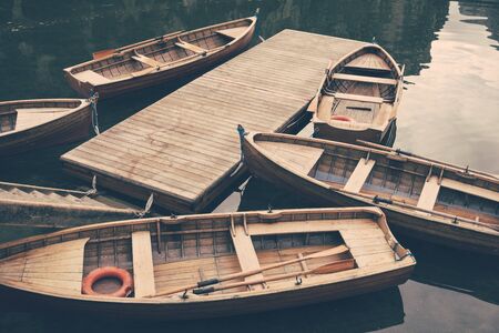 Wooden boat at the alpine mountain lake. Lago di Braies, Dolomites Alps, Italyの写真素材