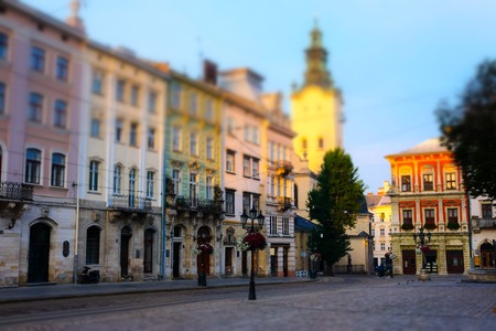 Old european early morning city square. Tilt-shift effectの写真素材