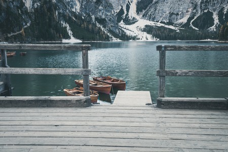 Wooden boat at the alpine mountain lake. Lago di Braies, Dolomites Alps, Italyの写真素材