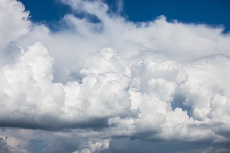 stormy rainy clouds over blue sky. Nature landscape backgroundの写真素材