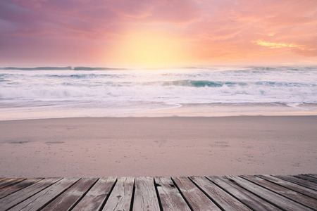 Sandy beach on bright sunny morning with wooden walkway. Tropical resortの写真素材