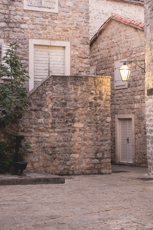 Old street at night illuminated by vintage streetlight. Budva, Montenegroの写真素材