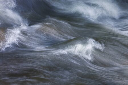 Abstract nature background of water flowing fastの写真素材