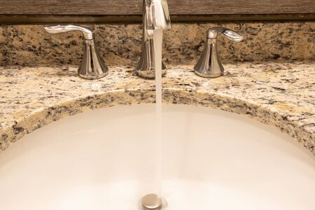 Luxury bath tub and faucet with water.の写真素材