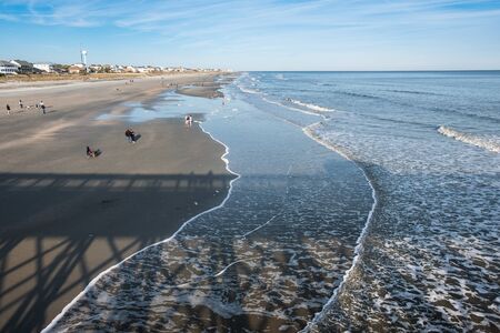 Aerial view of people walking on sandy beach. Summer seascape panoramic viewの写真素材