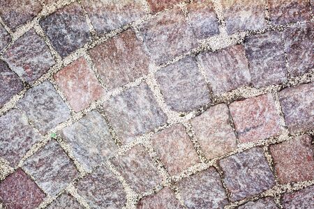 Rough texture of wet cobblestones, old side-streetの写真素材