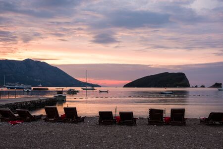 Budva bay sunrise. Panoramic view of marina, boats and old city. Montenegroの写真素材