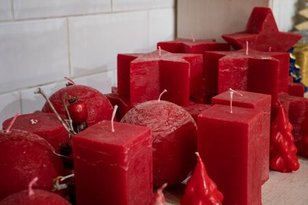 Colorful stick candles arranged in shelves and sorted by color in a candle shop.の写真素材