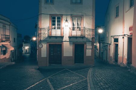 illuminated street at night. Old european city Evora, Portugal