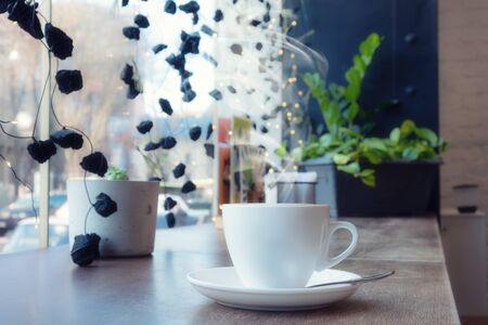 closeup of a cup of coffee at coffee shopの写真素材