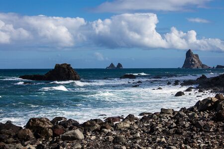 Seaside resort on Tenerife island. Ocean on a summer day, waves. Tourism and travel, vacation. Panoramic landscape.の写真素材