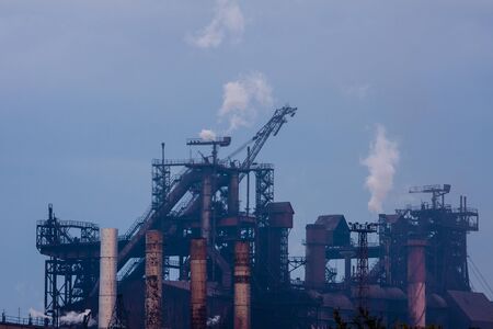 Plant with smoke. Air pollution and environment protection concept.