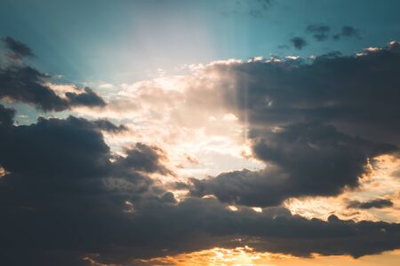 Sunset or sunrise with clouds, light rays and other atmospheric effect