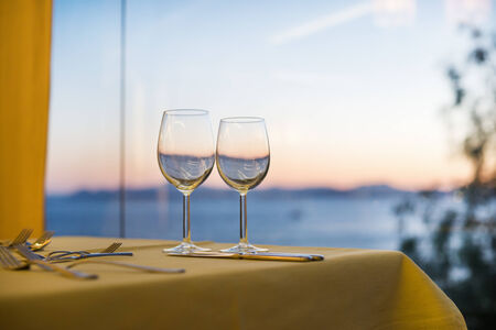 Two glasses against a seaの写真素材
