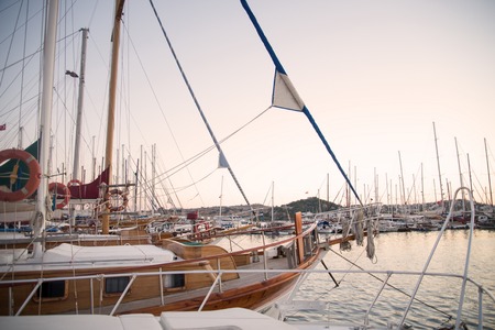 Marina with docked yachts at sunset