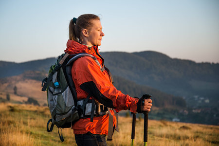 Young woman hiking in the mountainsの写真素材