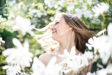 Beautiful Spring Girl with flowersの写真素材