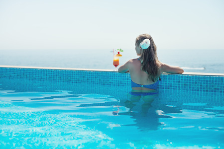 Woman relaxing at the pool 
