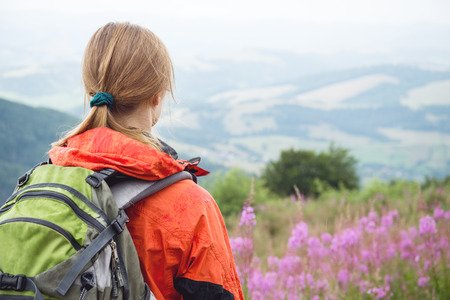 Young woman hiking in the mountainsの写真素材